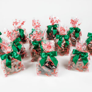 12 candy cane bags of chocolate pretzels with green bows.