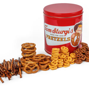 Red tin with pretzels on the table.