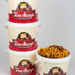Stack of plastic tubs with logo. One tub filled with pretzels.